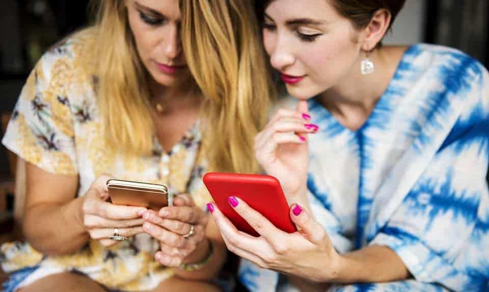 mobile game spenders - women using smartphones