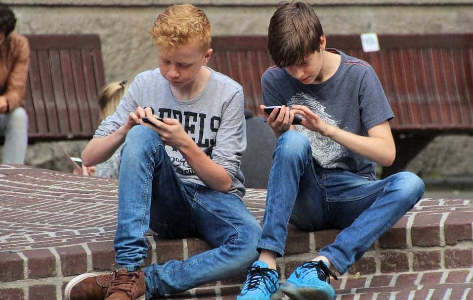 mobile phone ban - boys using cell phones