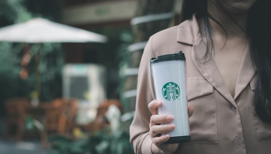 Starbucks Payment Pen - Woman holding Starbucks Coffee