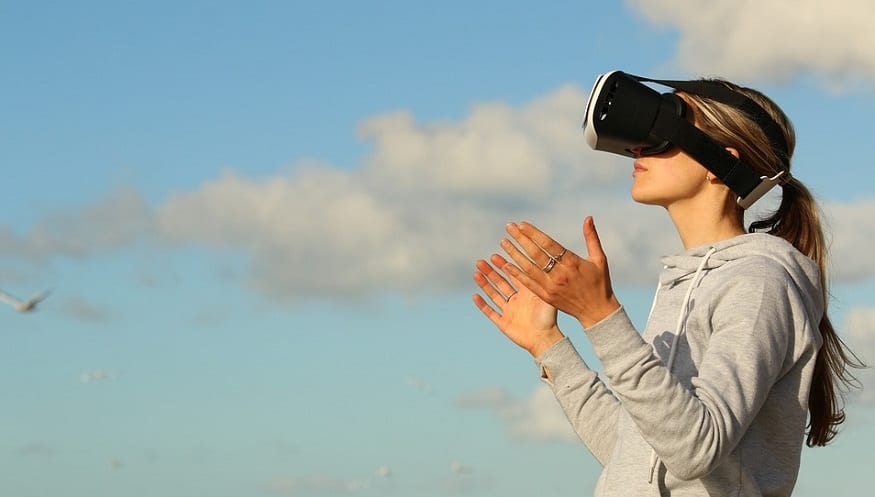 Virtual Reality nature - person wearing VR headset outside