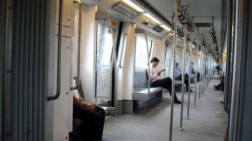 QR Code ticketing system - Passengers riding Delhi Metro train