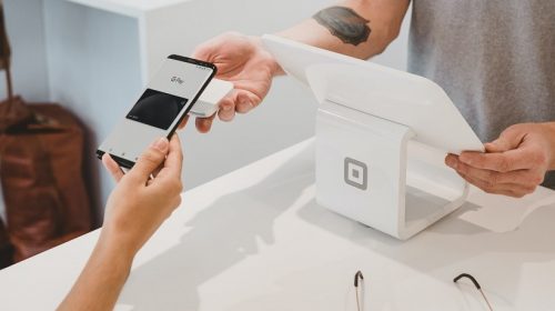 mobile wallet payments - person using google pay