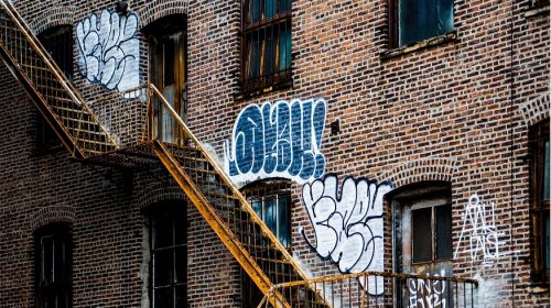 QR code signs - rundown building with graffiti