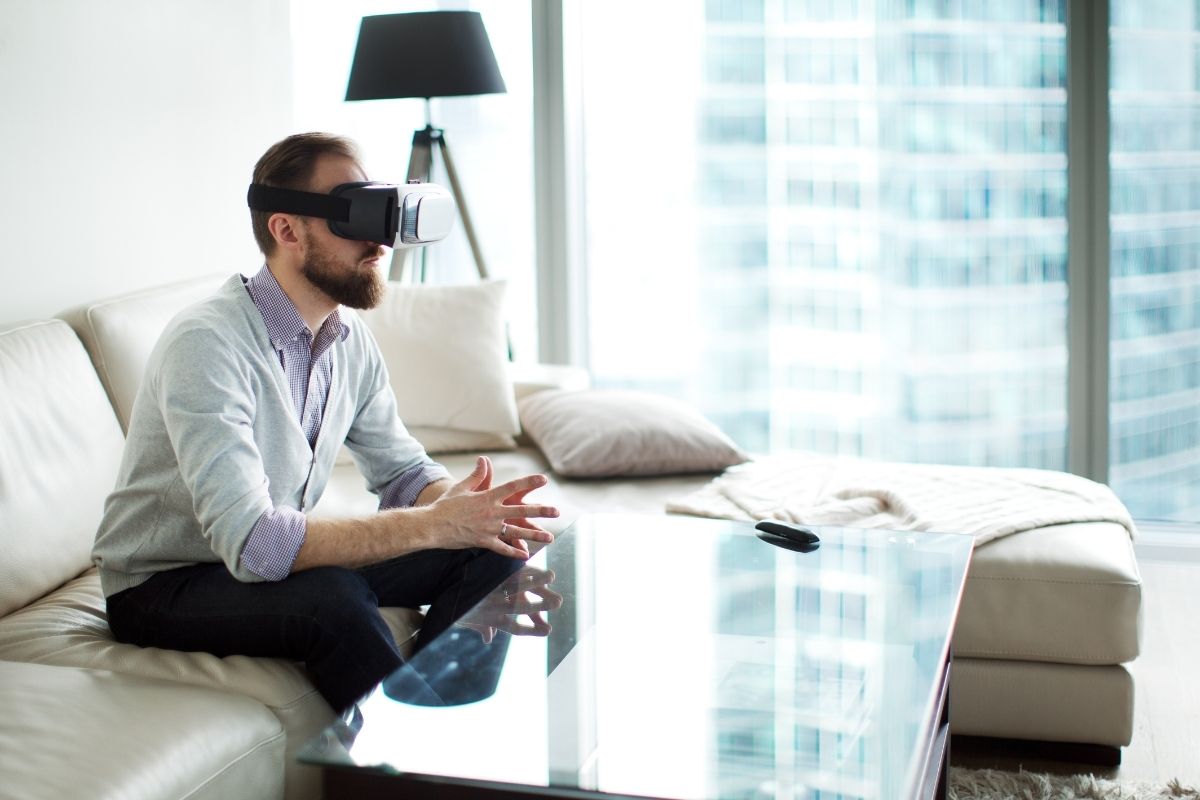 Virtual reality remote work - person sitting wearing VR headset