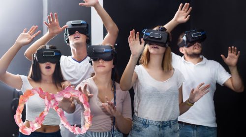 Virtual reality - Teens wearing VR headsets - Meta Logo made from flower petals