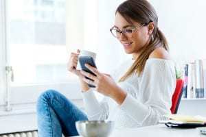 UK mobile commerce - Woman with mobile phone