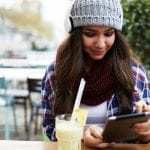 young woman tablet smartphone mobile app revenue