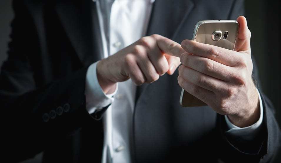 Mobile voting - Man using smartphone