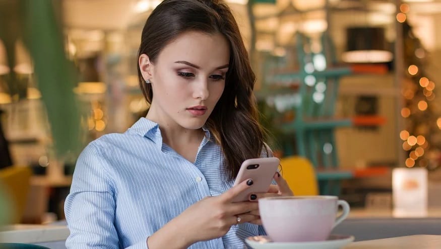 Holiday smartphone shopping - woman using mobile device