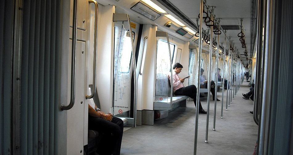 QR Code ticketing system - Passengers riding Delhi Metro train