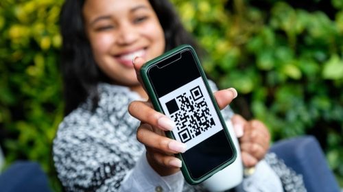 QR code campaign - person displaying QR code on phone