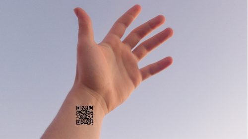 QR code tattoos - Image of hand with a QR code on wrist