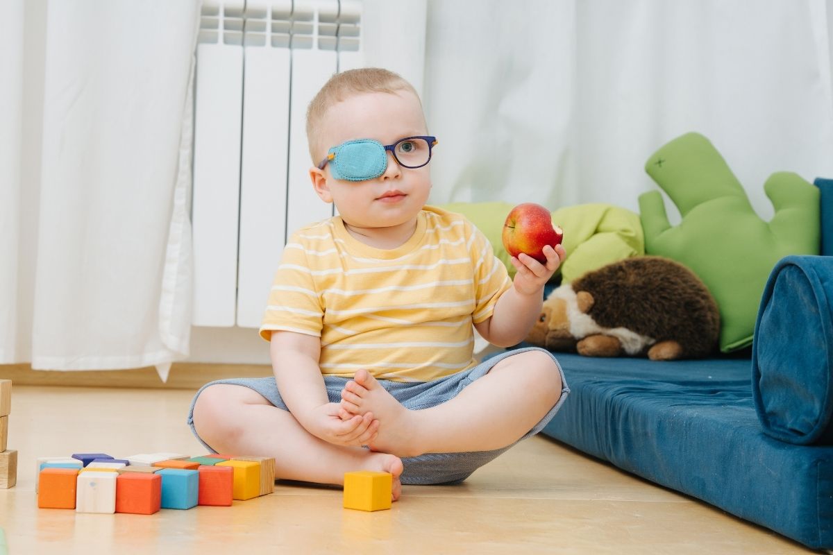 Virtual reality technology - child wearing patch for lazy eye