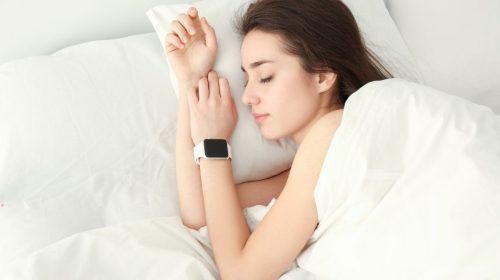 Wearable devices - Person sleeping wearing smartwatch