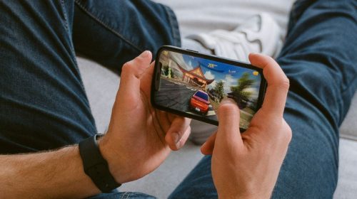 Mobile games - person playing a mobile game