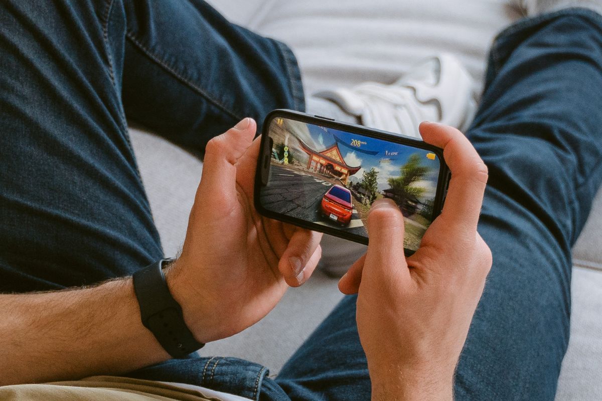 Mobile games - person playing a mobile game