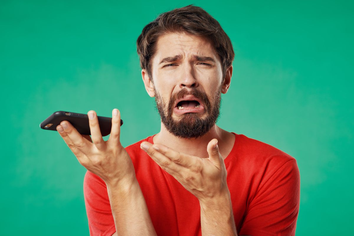 Person Stressed holding mobile phone