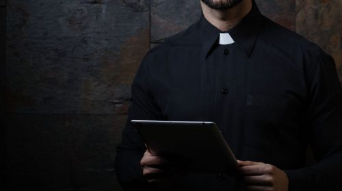 QR codes - A Priest using a tablet
