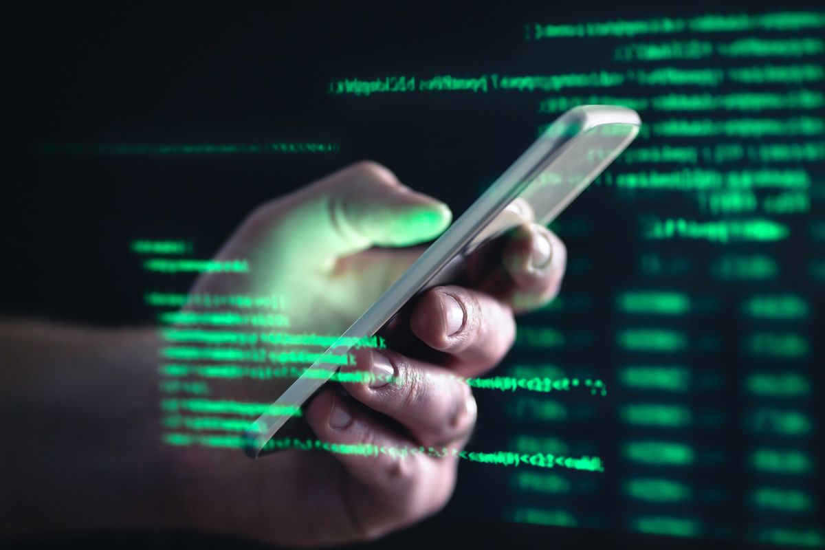 Quishing - Person using mobile - digital code