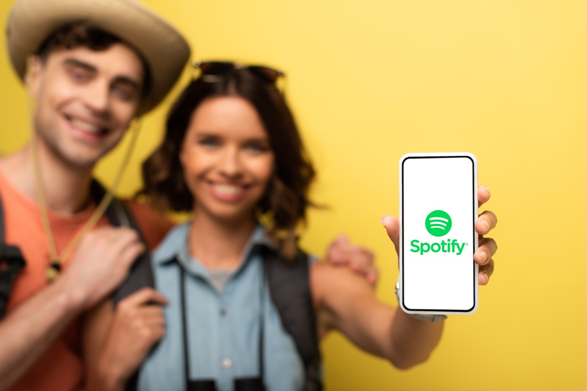 In-app sales - Happy people using Spotify