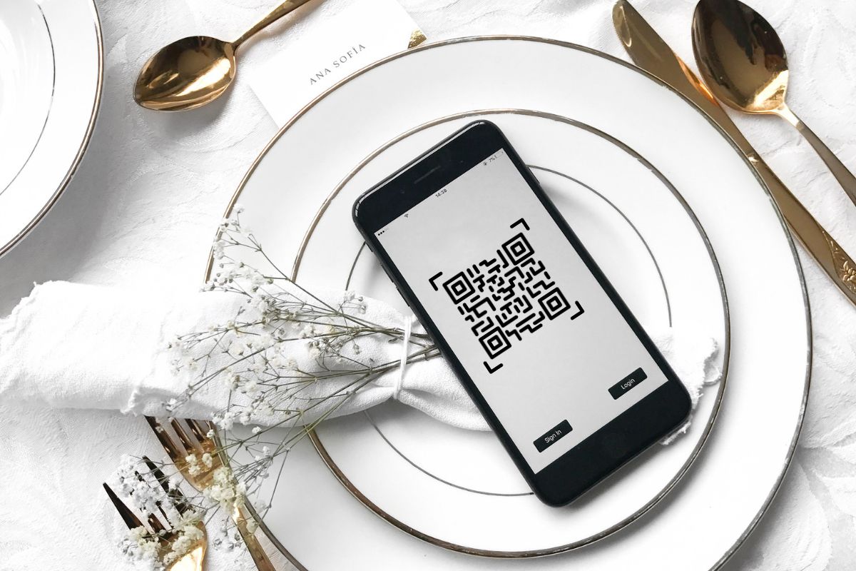 QR code on phone screen - dining table