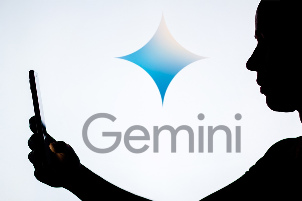 AI chatbot - Gemini Logo - Person Looking at phone