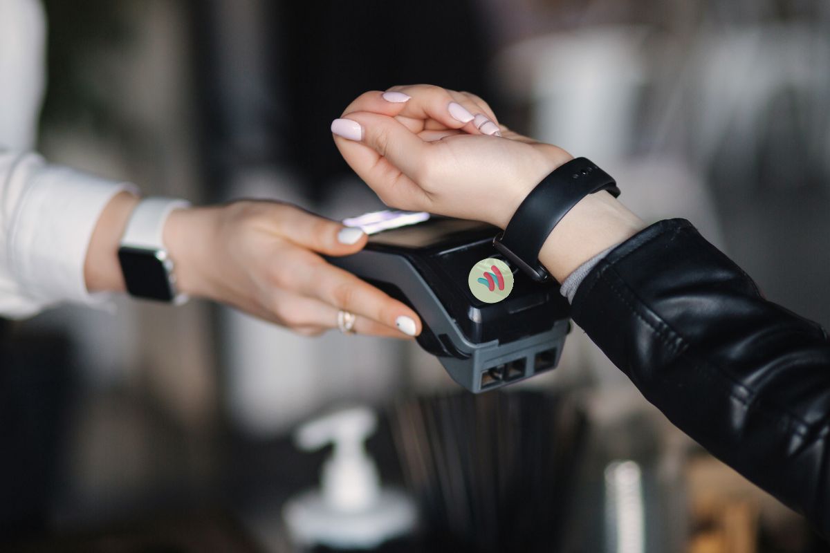 Mobile wallet - person using wearable device to pay - Google Wallet logo